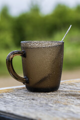Cup  on a wooden table in the garden