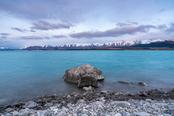 Scenic sunrise view of Lake Pukaki, with their mesmerizing turquoise hue and reflect the majestic...