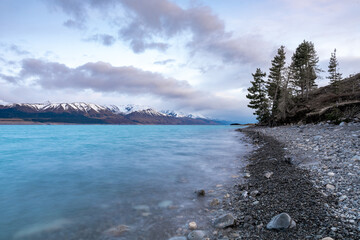 Scenic sunrise view of Lake Pukaki, with their mesmerizing turquoise hue and reflect the majestic...