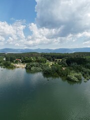 Fototapeta na wymiar The Koprinka dam - massive reservoir (lake) near the town of Kazanlak with the Balkan mountains in the backdrop 