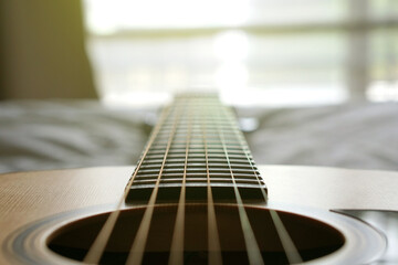 Fototapeta premium acoustic guitar, Used to play music and notes, for sing a song, macro abstract