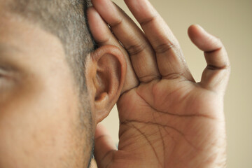 Fototapeta premium young man having ear pain touching his painful ear ,
