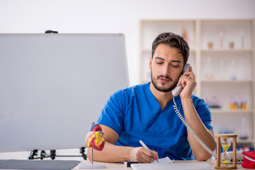 Young male doctor in telemedicine concept