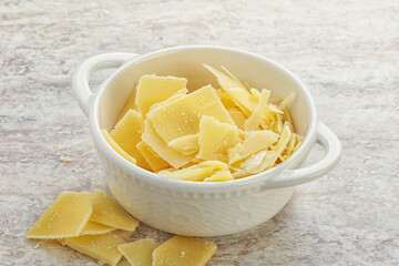 Sliced parmesan cheese heap in the bowl