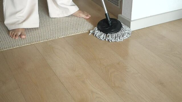 cleaning tiles floor with mop 