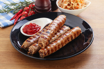 Grilled sausages with cabbage and sauce