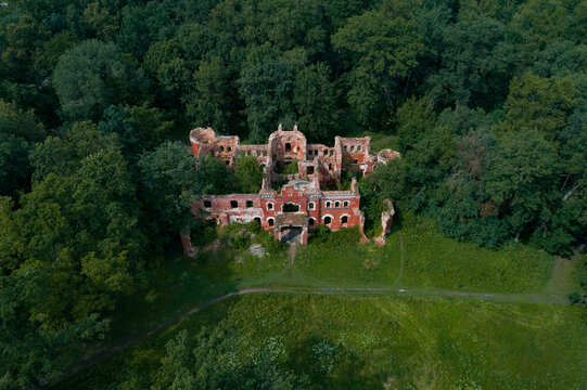 View from the height of the ruins of the ancient house of the estate of barons Vrangel on a sunny July day (aerial photography). Torosovo. Leningrad region, Russia