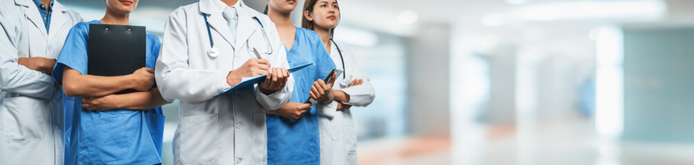 Confident medical staff team with doctor nurse and healthcare specialist professions people in...