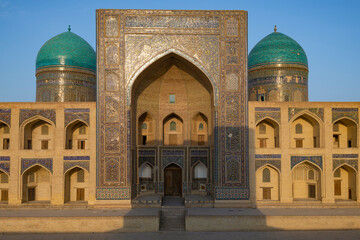 Fototapeta na wymiar Facade of the ancient Mir-i-Arab madrasah on a sunny evening, Bukhara