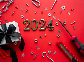 2024 and construction tools and wrapped gift on red background. Construction greeting card for...