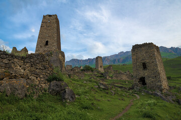 Fototapeta na wymiar View of the ancient Ossetian towers on a early June morning. Tsmiti. Northern Ossetia Alania. Russian Federation