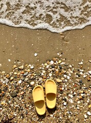 yellow sandals on the beach