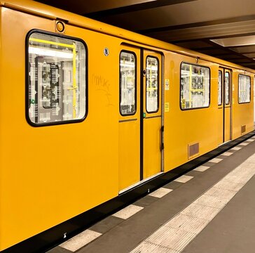 Berlin, Germany: yellow BVG subway train in the station