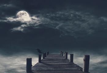 Wooden pier and dark clouds