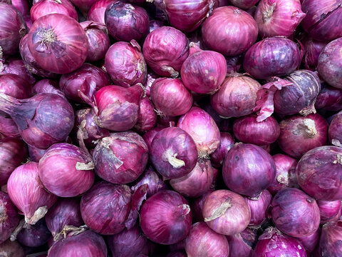 Various purple onions look beautiful and complement the background.