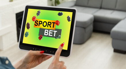 Smiling woman holding a mobile phone with sports betting website in the screen.