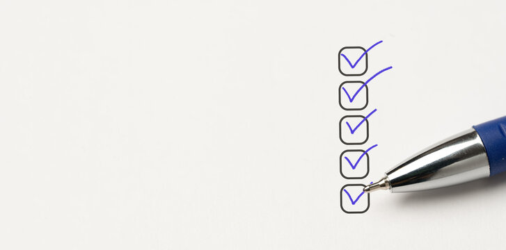 five checkboxes. pen writing check mark on Checklist. Checklist concept, checklist box with blue checkmark, paper and pen. Completed tasks are ticked off on to do list. copy space