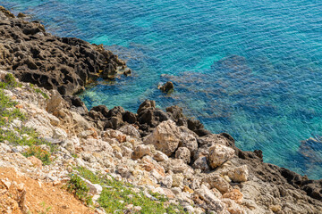 View of the rocky shore and crystal clear water of  Aegean Sea, Kolymvari (Kolymbari), Platanias, Crete, Greece