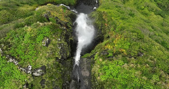 Flores island aerial view in Azores Ribeira do Ferreiro waterfalls in fog day