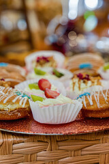 doughnuts and fruit tarts with wiped cream and glazed with chocolate and fondant , kids birthday...
