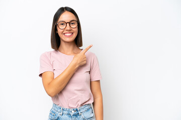 Young caucasian woman isolated on white background pointing to the side to present a product