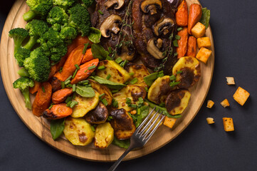 grilled vegetables with meat and mushrooms.