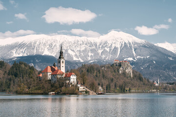 Fototapeta na wymiar Lake Bled: A Serene Escape with Saint Mary Church of Assumption on an Island, Surrounded by Majestic Mountains and Valleys
