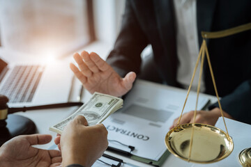 Lawyer accepts money, bribes businessman for partner in corruption in workplace.