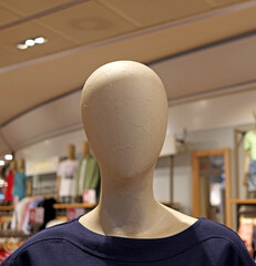 The head of a mannequin in a clothing store