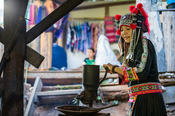 Hill tribes grinding coffee. Hill tribes grinding coffee beans, Manual coffee grinder.