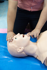 First aid CPR - clear airway training with head tilt chin lift technique.