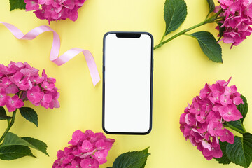 Fototapeta na wymiar Smartphone mockup with pink hydrangea flowers. Device screen mockup on stylish background for presentation or app design. Top view, copy space for text, product place. 