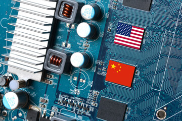 Flag of the Republic of China and the United States on microchips of a printed electronic board....
