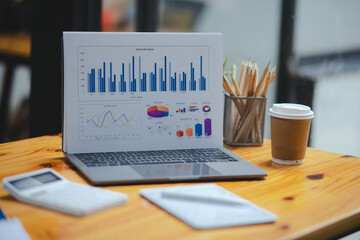 Fototapeta na wymiar Analytics sales data and economic growth chart on laptop computer at office desk. 