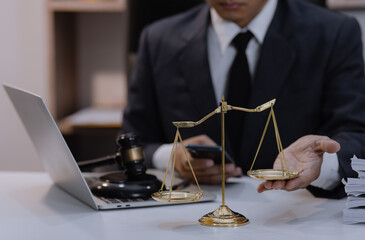 Asian lawyer working with contract at desk, justice and law concept.