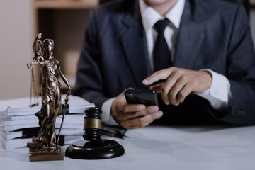 Asian lawyer working with contract at desk, justice and law concept.