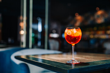 alcohol cocktail in a glass stands on a table in a bar or restaurant