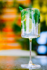 alcohol cocktail in a glass stands on a table in a bar or restaurant