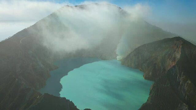 Aerial view from drone flying to mount Kawah Ijen crater, Sulfur mining in an active volcano, Java, Indonesia 
