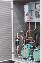 Soundproof cabinet for compressor refrigeration unit.