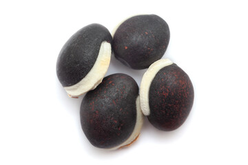 Close-up of Dried Organic Semphali or Hyacinth bean (Lablab purpureus) seeds isolated on white background. Top view.