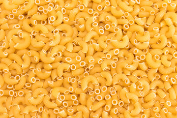 Uncooked Chifferi Rigati Pasta Background. Fat and Unhealthy Food. Classic Dry Macaroni Texture. Italian Culture and Cuisine. Raw Pasta