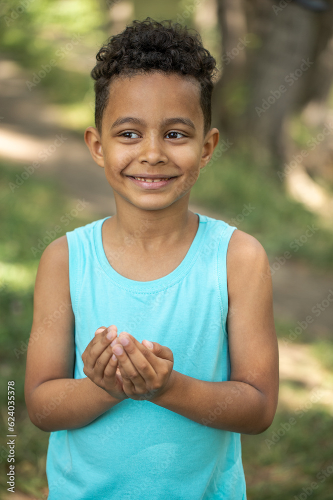 Wall mural Close up portrait of a young beautiful african boy