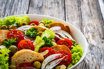 Bloody Mary panzanella salad on wooden table