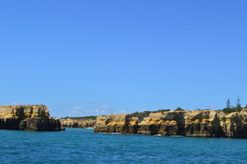 Yellow rocks near the sea in Faro city Portugal