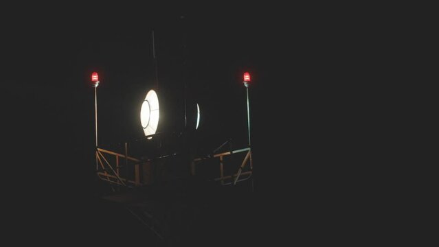 Rotating Airport Beacon at Night