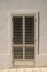 Traditional door shutters as blinds close up in Italy