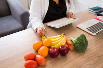 Healthy fruits and vegetables at the nutritionist desk