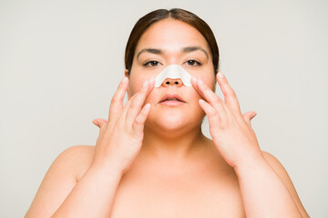 Overweight beautiful woman with nose blackheads