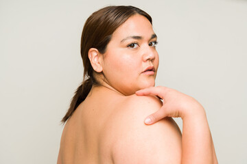 Gorgeous fat woman seen from behind in a beauty concept